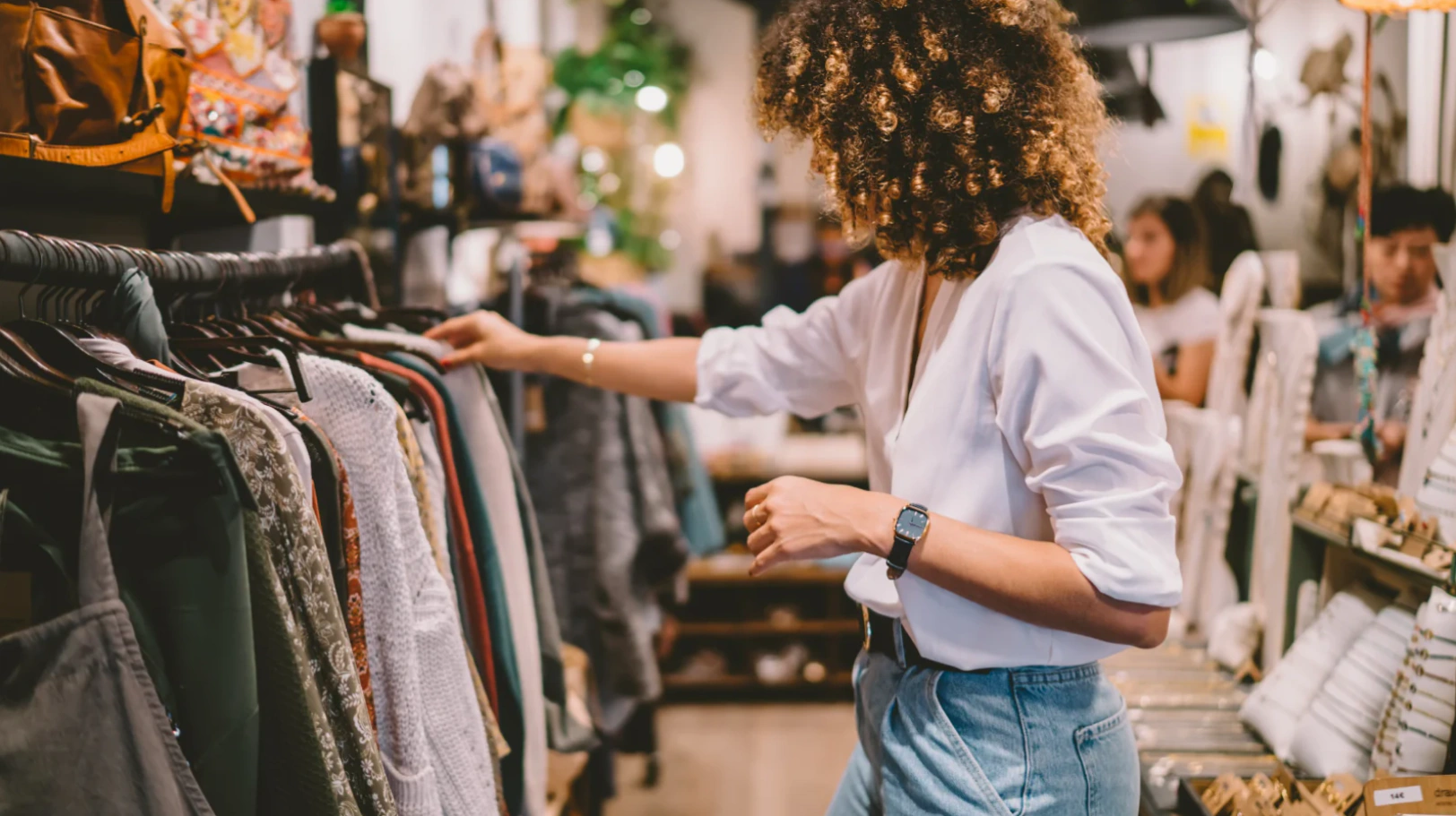 A customer browsing clothing in a retail store